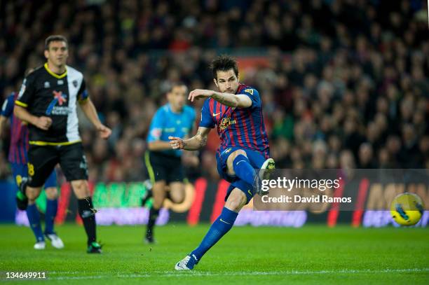 Cesc Fabregas of FC Barcelona scores the opening goal during the La Liga match between FC Barcelona and Levante UD at Camp Nou on December 3, 2011 in...