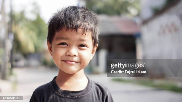 portrait of asian boy  outdoor - only boys photos stockfoto's en -beelden