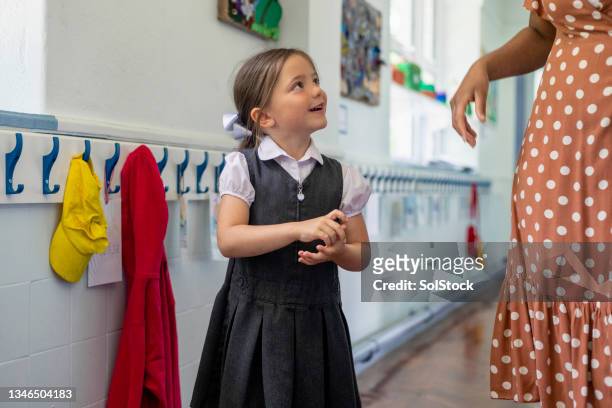 talking with my favourite teacher - pinafore dress stock pictures, royalty-free photos & images