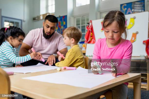 drawing with chalk - child care stockfoto's en -beelden