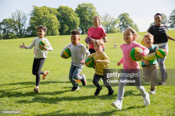 children having fun with sport - running coach stock pictures, royalty-free photos & images