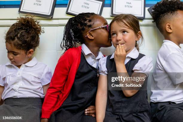 can i tell you a secret? - school kids stock pictures, royalty-free photos & images