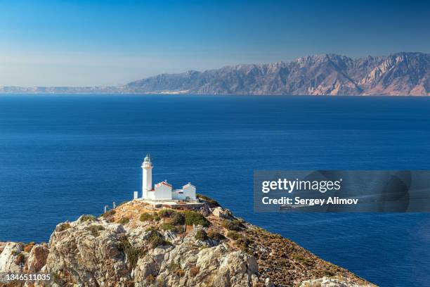 lighthouse near knidos ancient city against kos island - aegean turkey stock-fotos und bilder