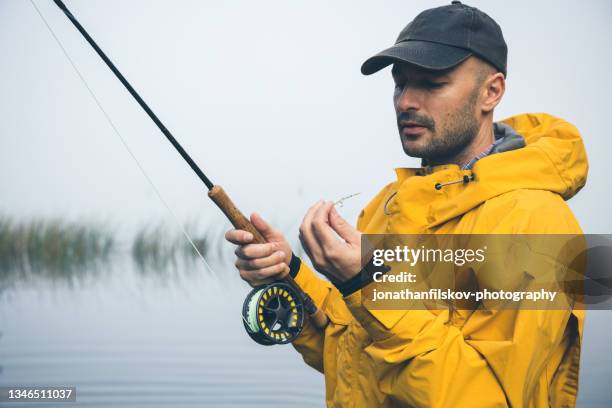 fly-fishing in morning mist - freshwater fishing stock pictures, royalty-free photos & images