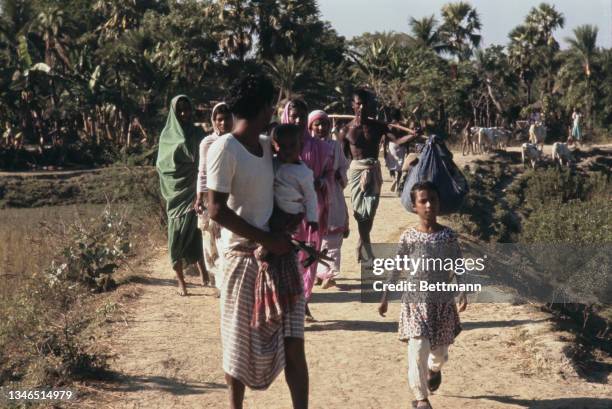 Locals on a road near the Indian border, during the Bangladesh Liberation War, in Satkhira, Bangladesh, 29th November 1971. Fighting in the region...