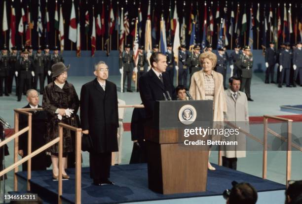 American politician Richard Nixon welcomes Empress Kojun and Hirohito with First Lady Pat Nixon to the right of the frame, after Hirohito and his...