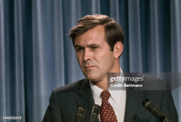 American politician and government official Donald Rumsfeld , counsellor to the President and director of the Cost of Living Council, ponders a...