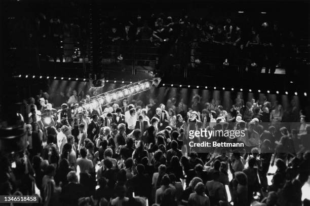 High angle view of dancers on the dancefloor below at the reopened Studio 54 in Midtown Manhattan, New York City, New York, 25th September 1979.