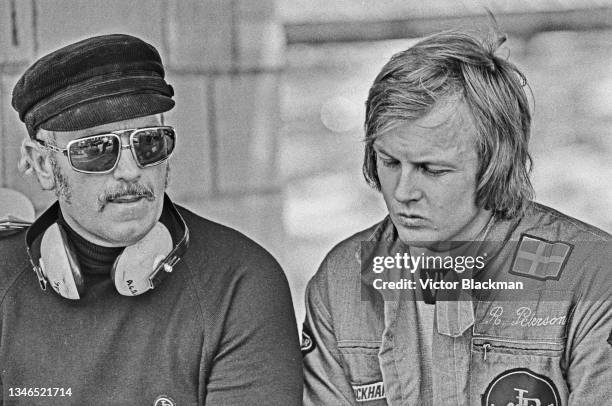 English design engineer Colin Chapman and Swedish racing driver Ronnie Peterson at Brands Hatch, UK, July 1974.