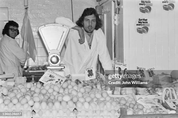 British athlete Steve Ovett helps out at his father's farm produce shop in Brighton, UK, 14th August 1974.