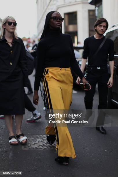 Deborah Ababio is seen wearing a Pair of Yellow Track Bottoms at Richard Quinn, during London Fashion Week September 2021 on September 21, 2021 in...