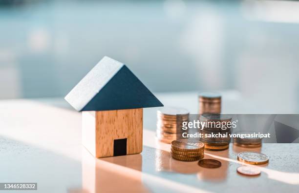 home concept,home savings,selling home,money and house - haus geld stock-fotos und bilder