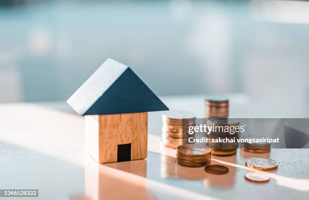 home concept,home savings,selling home,money and house - impuesto fotografías e imágenes de stock