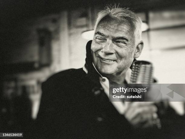 the entertainer. - rock musician stock pictures, royalty-free photos & images