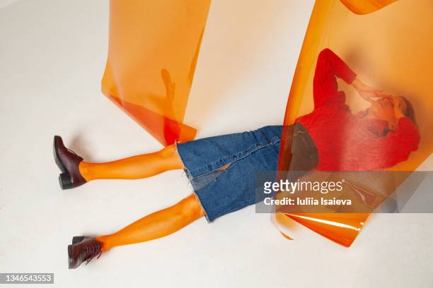frustrated woman lying on floor in studio - art modeling studio stock pictures, royalty-free photos & images