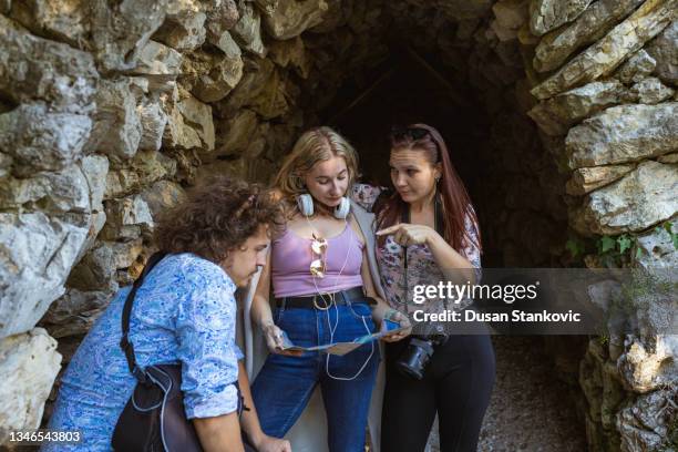 group of adventurous students and tourists, making a decision while using a city map what should they see next - city map with points of interest stock pictures, royalty-free photos & images