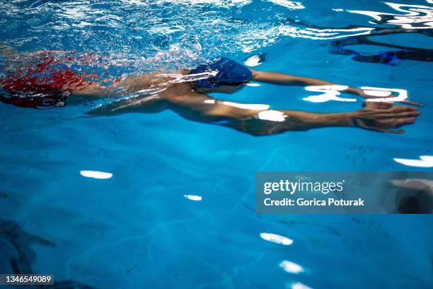 male swimmer at the swimming pool. underwater - swimming stroke stock pictures, royalty-free photos & images