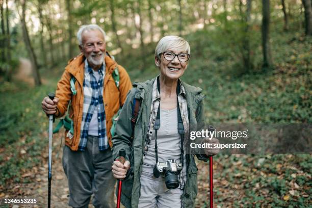 enjoying nature together - nordic walking stock pictures, royalty-free photos & images