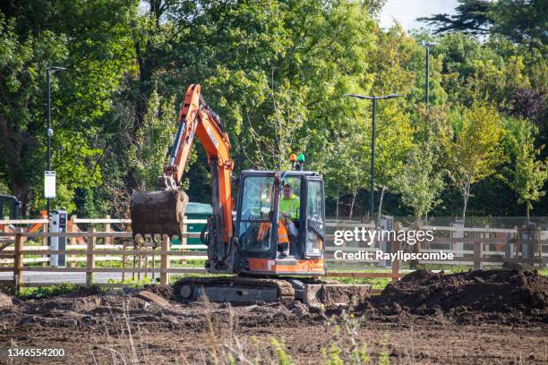 Man Operating Backhoe 558 Backhoe Operator Stock Photos, High-Res Pictures, and Images ...