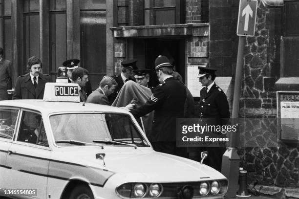 Heavy police presence outside the courthouse on Ward Street in Guildford, where three men and a women later known as the Guildford Four, are being...