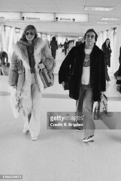 English actor and comedian Peter Sellers with his girlfriend, Swedish model Christina 'Titi' Wachtmeister, at London's Heathrow Airport, UK, 23rd...