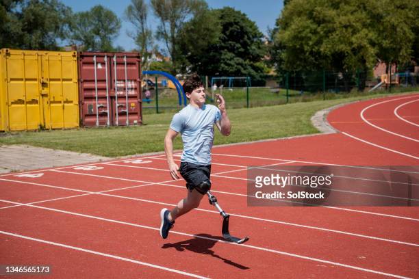 cardio training - boy running track stock pictures, royalty-free photos & images