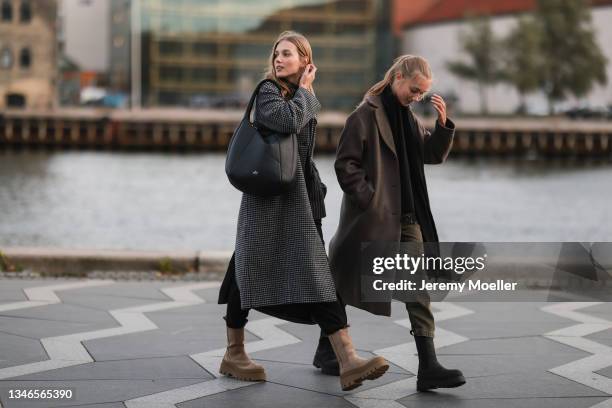 Amalie Moosgaard Nielsen wearing a plaid coat, black pants, a black copenhagen studios bag and beige copenhagen studios boots and Cecile Moosgaard...
