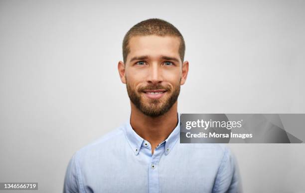 handsome young adult businessman with stubble - white shirt stock pictures, royalty-free photos & images