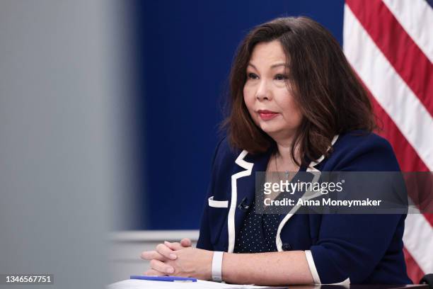 Sen. Tammy Duckworth listens as U.S. Vice President Kamala Harris speaks at a virtual town hall with care providers from the South Court Auditorium...