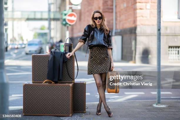 Carrying his louis vuitton travel bag hi-res stock photography and images -  Alamy