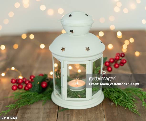 lantern with christmas ornaments on wooden table copy space - maria castellanos stock pictures, royalty-free photos & images