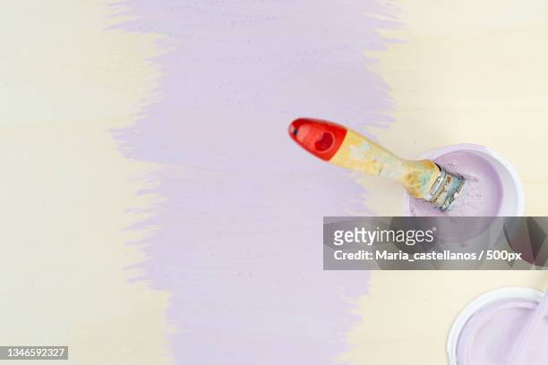 directly above shot of paintbrush on table - maria castellanos stock pictures, royalty-free photos & images