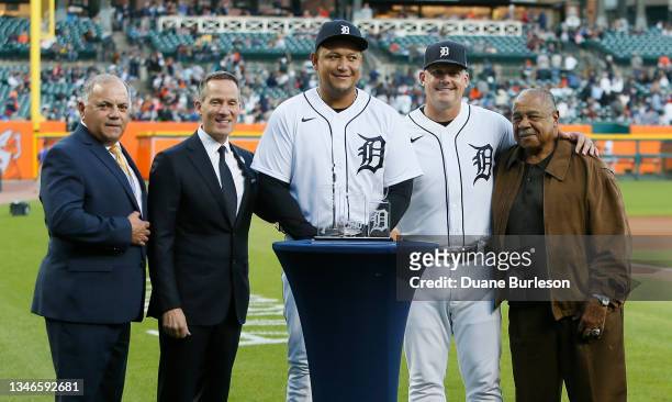 Miguel Cabrera of the Detroit Tigers, center, with General Manager Al Avila, Chairman and CEO Christopher Ilitch, manager A.J. Hinch and former...