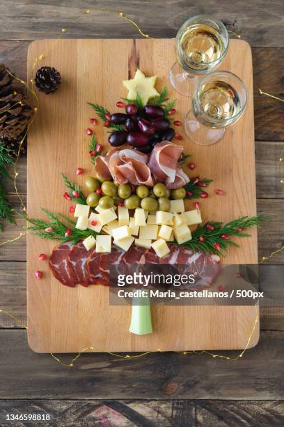 high angle view of food on cutting board over table - maria castellanos stock pictures, royalty-free photos & images