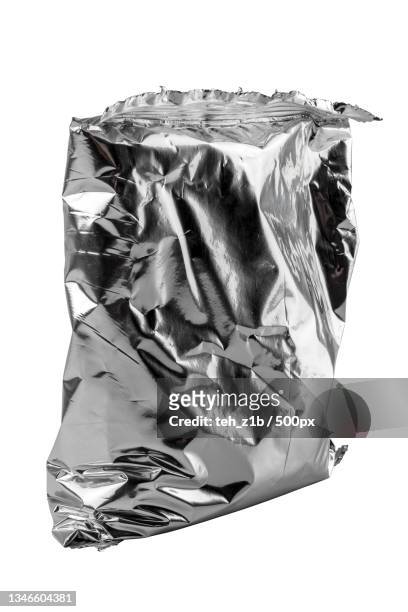 close-up of crumpled foil against white background - vacuum packed stock pictures, royalty-free photos & images