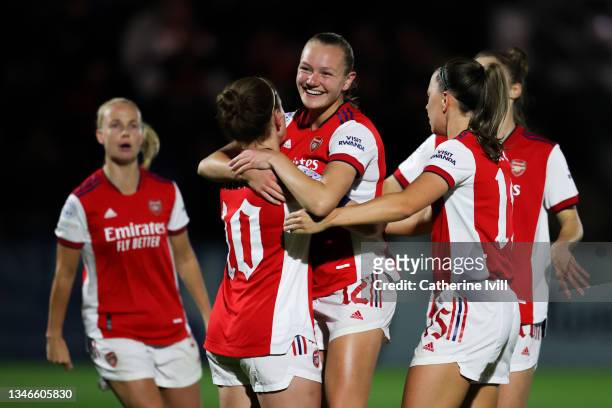 Kim Little of Arsenal Women FC celebrateswith her team mate Frida Maanum after scoring his team's first goal from the penalty spot during the UEFA...