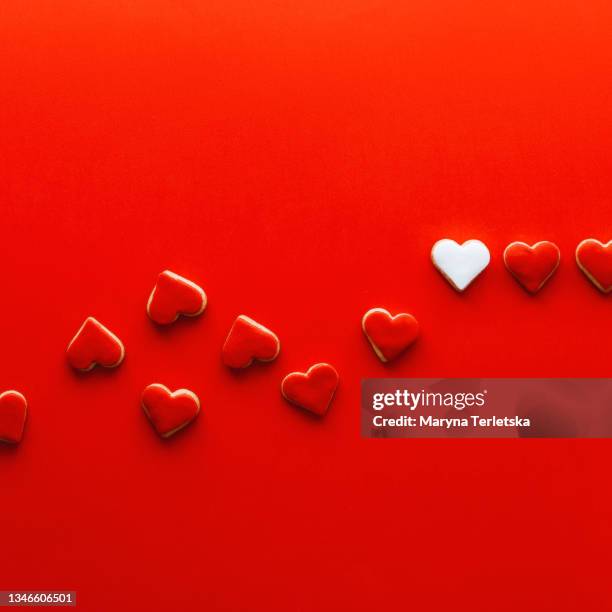 background with small cookies in the shape of a heart. - wicker heart stock pictures, royalty-free photos & images