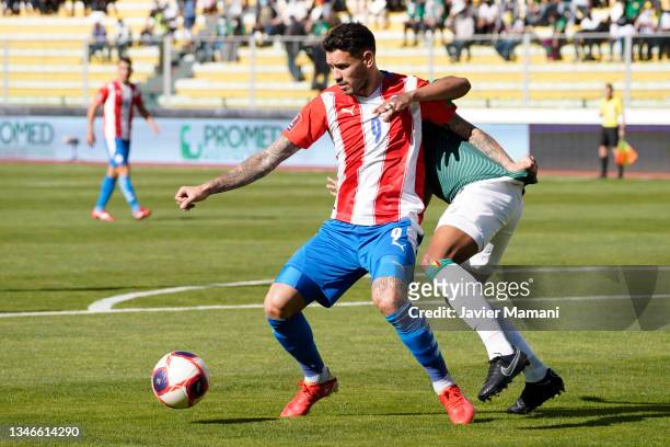 Antonio Sanabria of Paraguay and Jairo Quinteros of Bolivia fight for the ball during a match between Bolivia and Paraguay as part of South American...