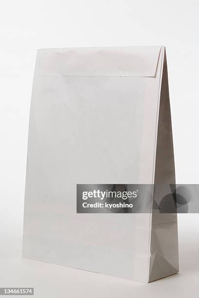 isolated shot of closed blank paper bag on white background - papperskasse bildbanksfoton och bilder