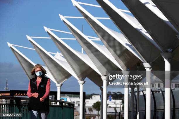 People walk across the Victoria Canopy Bridge at the Town Basin on October 15, 2021 in Whangarei, New Zealand. Alert Level 3 restrictions remain in...