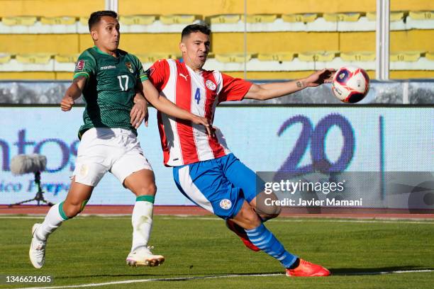 Roberto Fernandez of Bolivia and Fabian Balbuena of Paraguay fight for the ball during a match between Bolivia and Paraguay as part of South American...