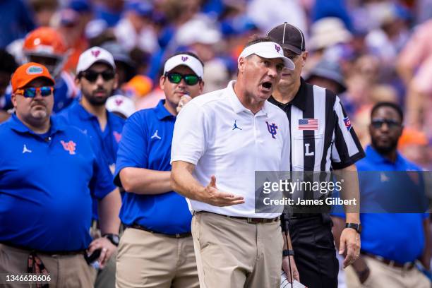 Head coach Dan Mullen of the Florida Gators talks with an official during the third quarter of a game against the Vanderbilt Commodores at Ben Hill...