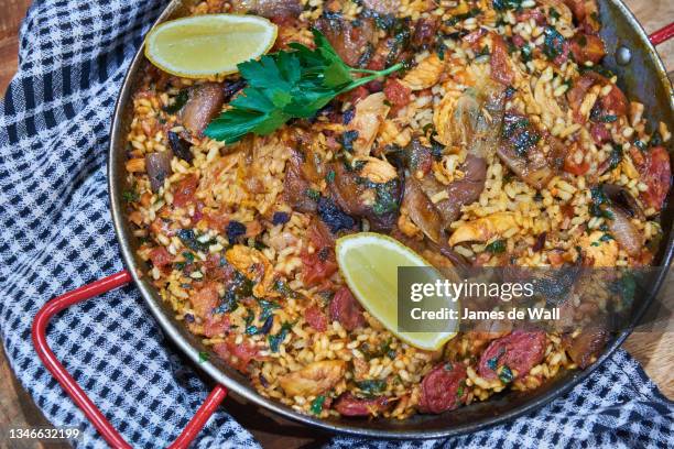 chicken & chorizo paella - spain food stock pictures, royalty-free photos & images