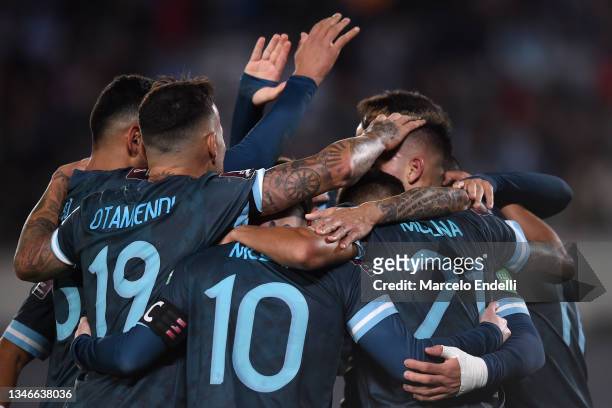 Lautaro Martinez of Argentina celebrates with teammates after scoring the first goal of his team during a match between Argentina and Peru as part of...