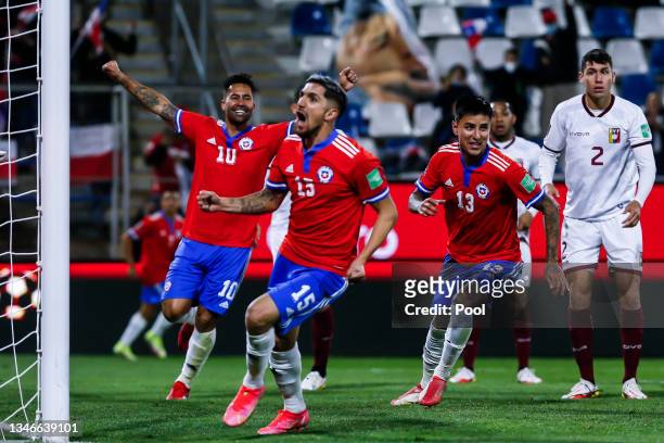 Luis Jiménez, Diego Valdés and Erick Pulgar of Chile celebrate their team's first goal during a match between Chile and Venezuela as part of South...