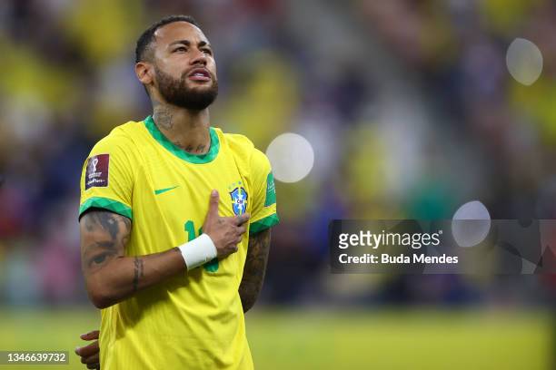 Neymar Jr. Of Brazil sings the national anthem prior to a match between Brazil and Uruguay as part of South American Qualifiers for Qatar 2022 at...