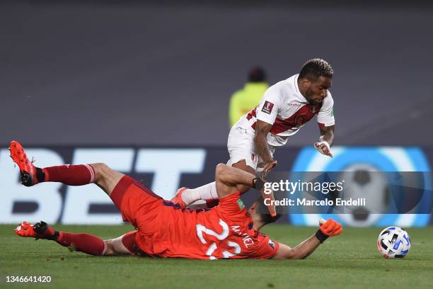 Jefferson Farfan of Peru is fouled by Emiliano Martinez of Argentina during a match between Argentina and Peru as part of South American Qualifiers...