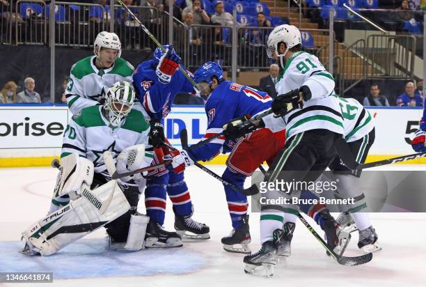 Braden Holtby of the Dallas Stars makes the second period save on Kevin Rooney of the New York Rangers at Madison Square Garden on October 14, 2021...