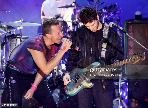 In this image released on October 14 Chris Martin and Guy Berryman of Coldplay perform live onstage at the iHeartRadio Album Release Party with...