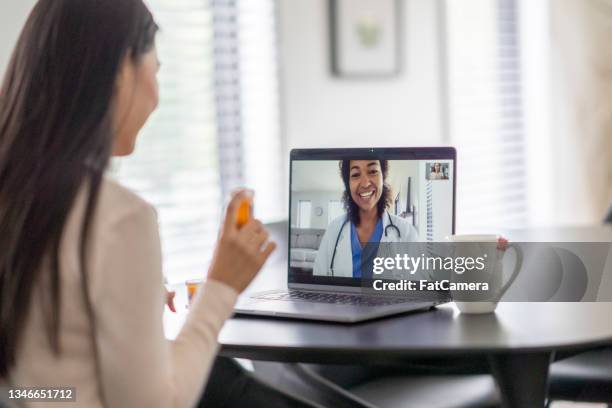 patient asking about medication during a telehealth call - virtual care stock pictures, royalty-free photos & images